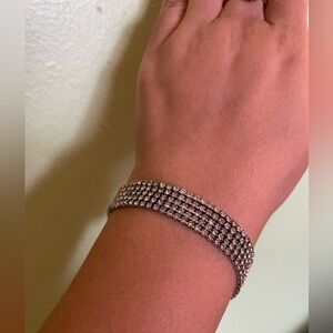 Elegant four strand Silver Bracelet with sparkly stones